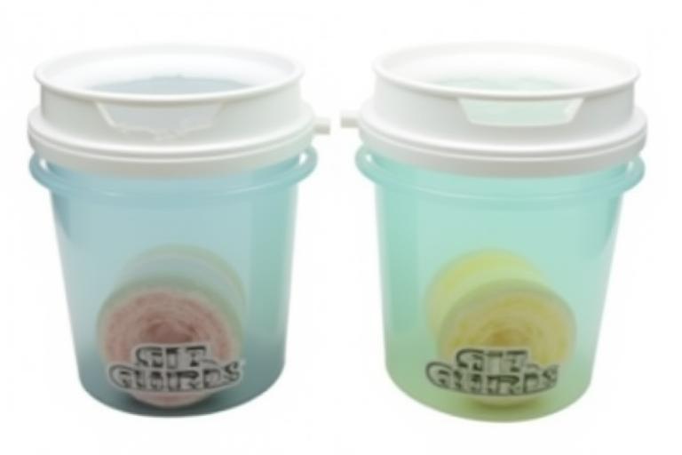 Two detailing buckets with Grit Guards installed, ready for a safe car wash